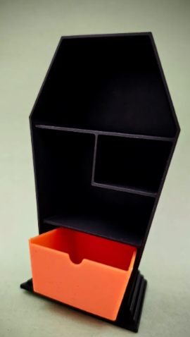 Large coffin shelf with orange working drawer, side angle view