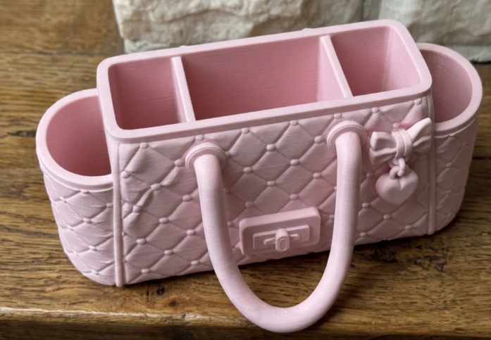 Luxury handbag desk organizer pink top view showing three interior compartments