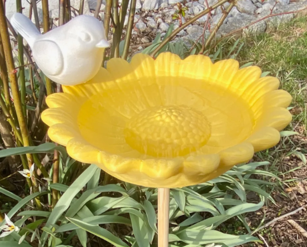 3D printed yellow sunflower bird bath with white bird on garden stake
