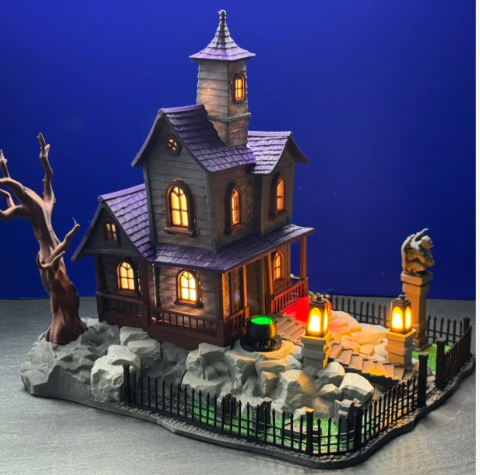 Illuminated Halloween Haunted House Scene - cauldron and pumpkin detail