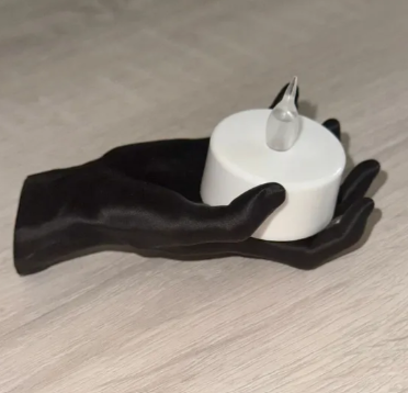 Matte black creepy hand wall holder with LED tealight candle
