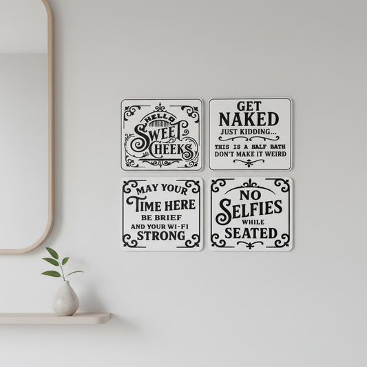 Set of 4 funny bathroom signs displayed in a modern minimalist bathroom