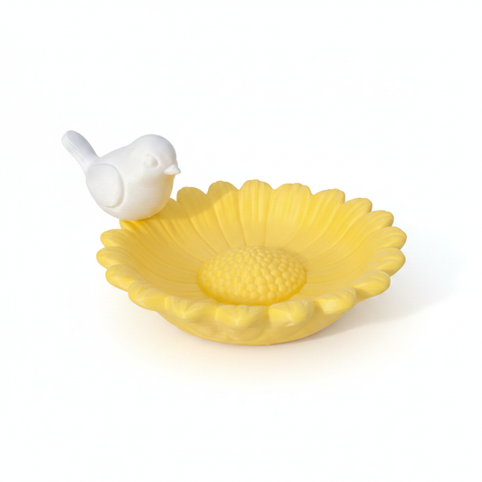 Yellow flower bird bath with white bird front view on white background
