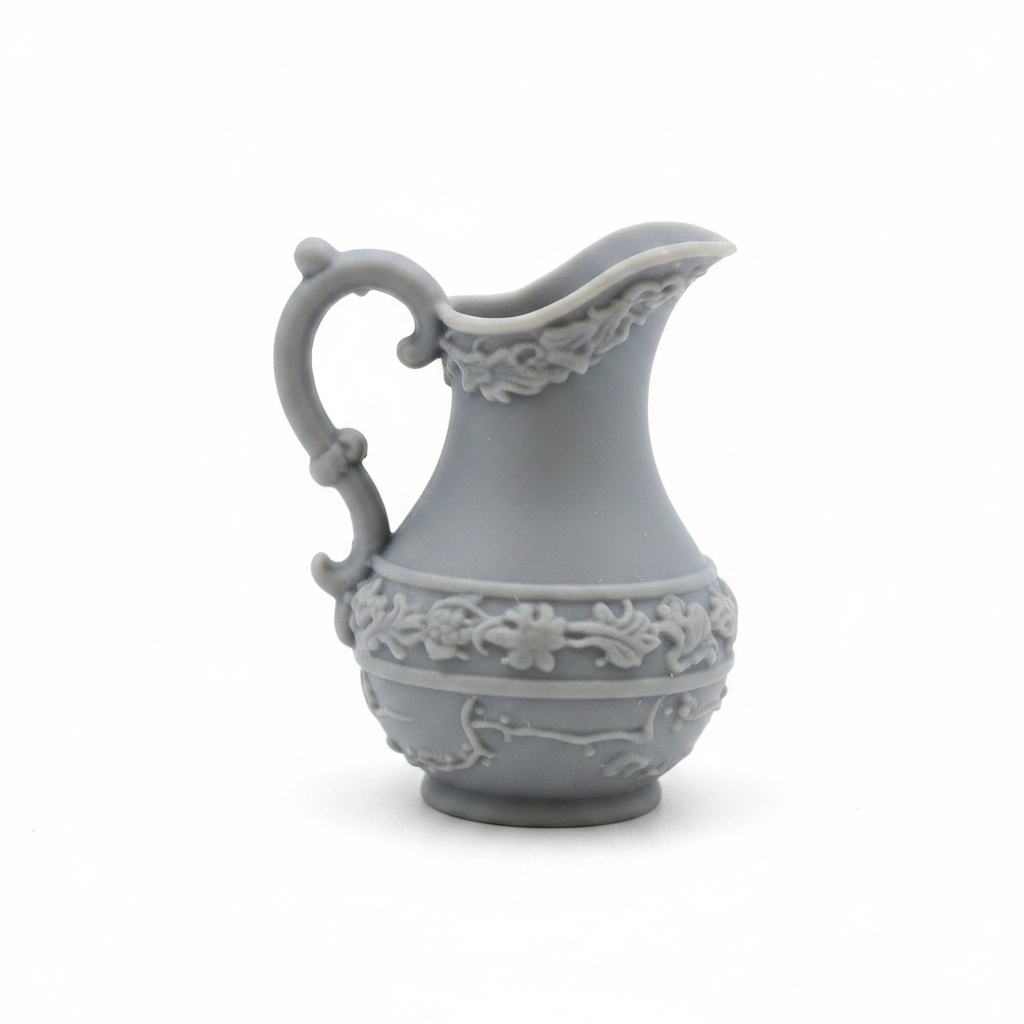 Victorian miniature water pitcher close-up on white background