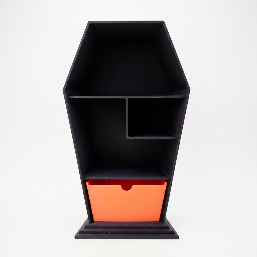 3D printed black coffin shelf with orange drawer on white background studio shot