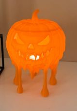 Large melting jack-o-lantern glowing with warm light from inside