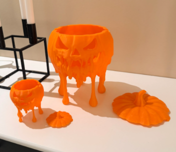 Melting jack-o-lantern pumpkins showing removable lid and small size together