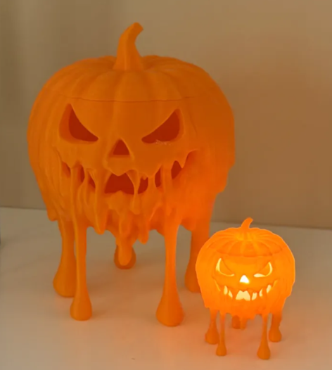 3D printed melting jack-o-lantern pumpkins in small and large sizes, large glowing from inside