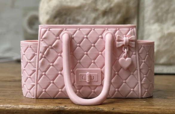 Luxury handbag desk organizer pink front view showing quilted pattern and bow