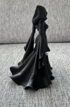 Lady Reaper - side view showing dramatic silhouette and robe flow